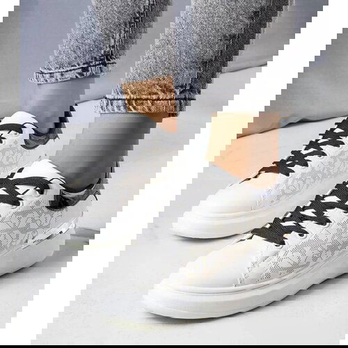 Gemre White and black sneakers decorated with perforation Erin Slike