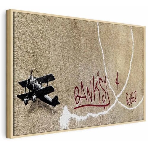  Slika - Banksy\'s Plane (1-part) - Red Graffiti Text on Mural Background 60x40 U prirodnom drvenom okviru Cijene