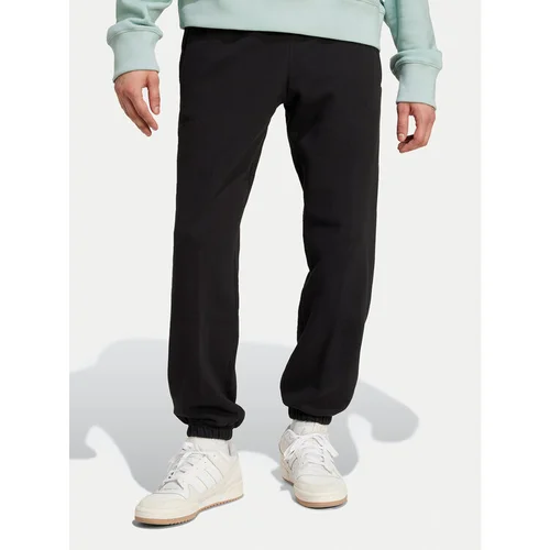 Adidas Spodnji del trenirke Premium Essentials IY2245 Črna Loose Fit