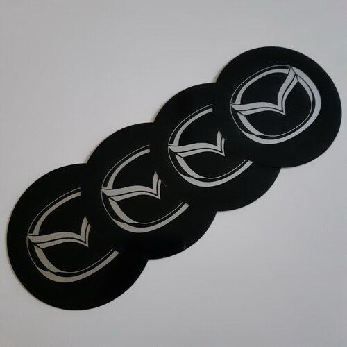  STIKERI ZA RATKAPE MAZDA FI76mm SET 4 KOMADA Slike