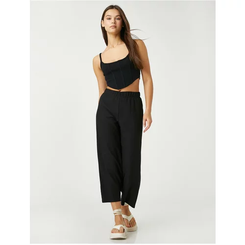 Koton The relaxed fit trousers have an elasticated waist and cropped legs.