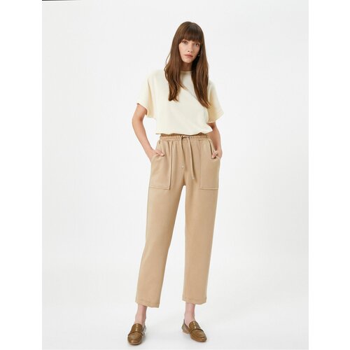 Koton Tie Waist Trousers with Suede Textured Pockets and Tapered Legs. Slike