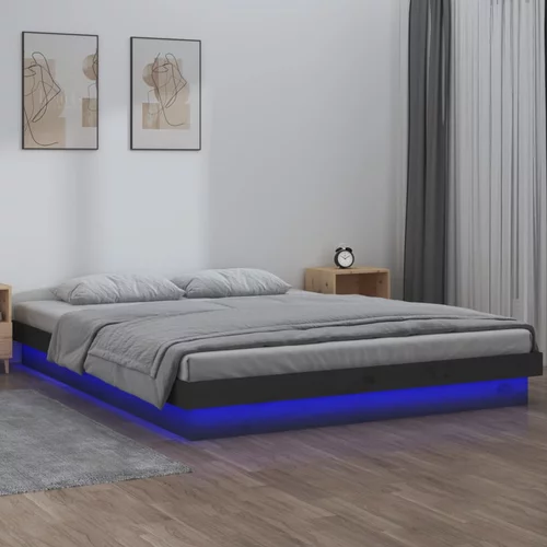 vidaXL LED posteljni okvir siv 140x190 cm trden les