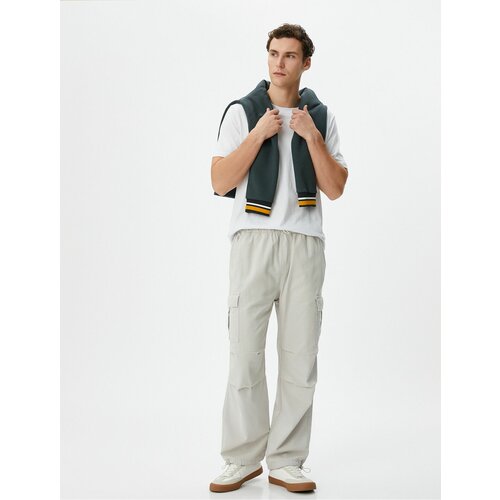 Koton Cargo Parachute Loose Trousers with Elastic Waist Pocket Detail and Stoppers Cene