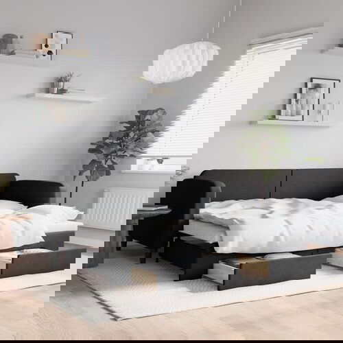 VidaXL Dnevni krevet na razvlačenje s ladicama crni 90x200 cm tkanina Slike