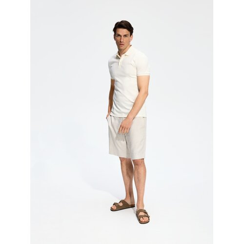 Reserved Slim polo-majica - krem Cijene