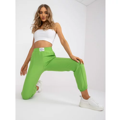 Fashion Hunters Women's light green fabric trousers with no fastening