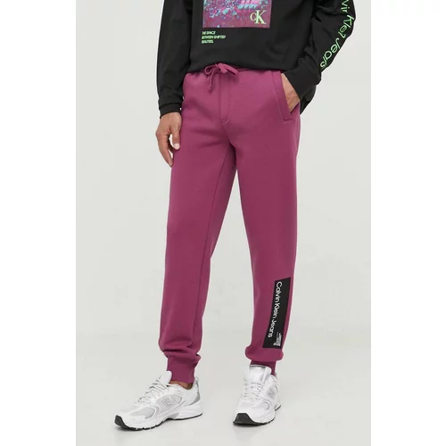 Calvin Klein Jeans Spodnji del trenirke vijolična barva