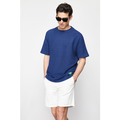 Trendyol navy blue men's regular cut short sleeve textured labeled t-shirt Cene