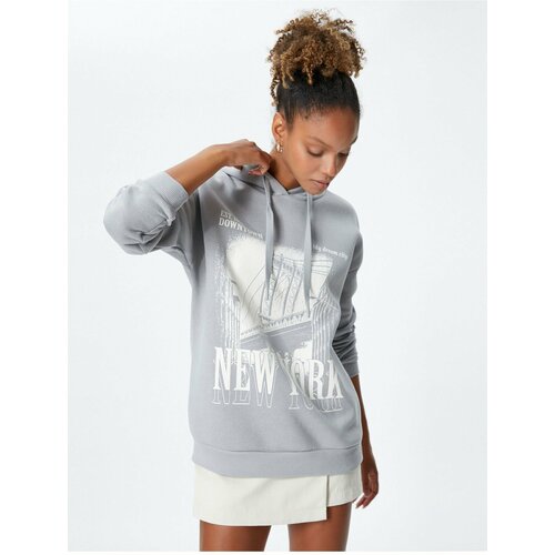 Koton Hooded Sweatshirt with a slogan printed, relaxed fit and long sleeve. Slike