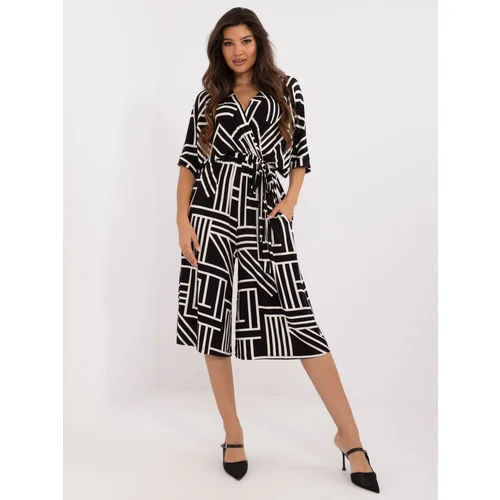 Fashion Hunters Black patterned jumpsuit with tie on the back