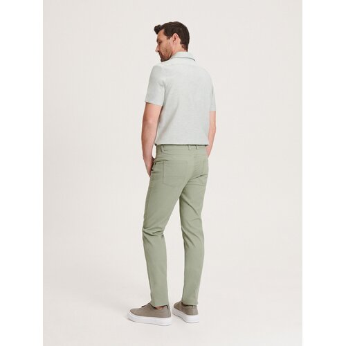 Reserved - Bombažne hlače slim fit - Turkizna Cene