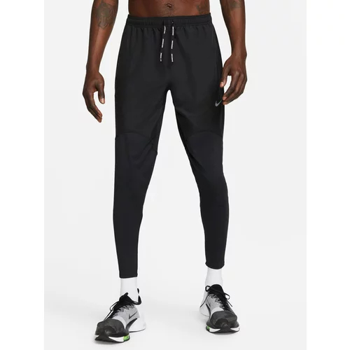 Nike Sportske hlače 'Fast' crna / srebro
