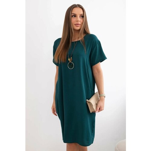 Kesi Dress with pockets and a pendant in dark green Slike